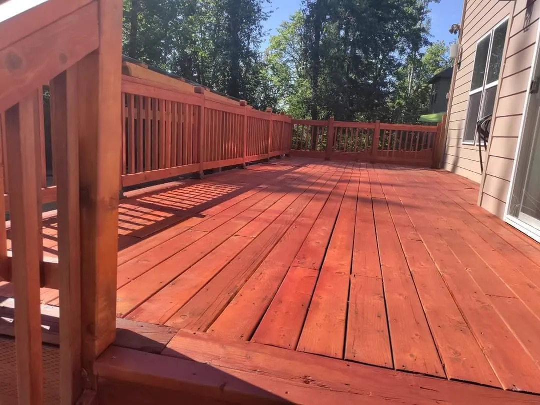 After: the same deck sealed in a warm redwood stain