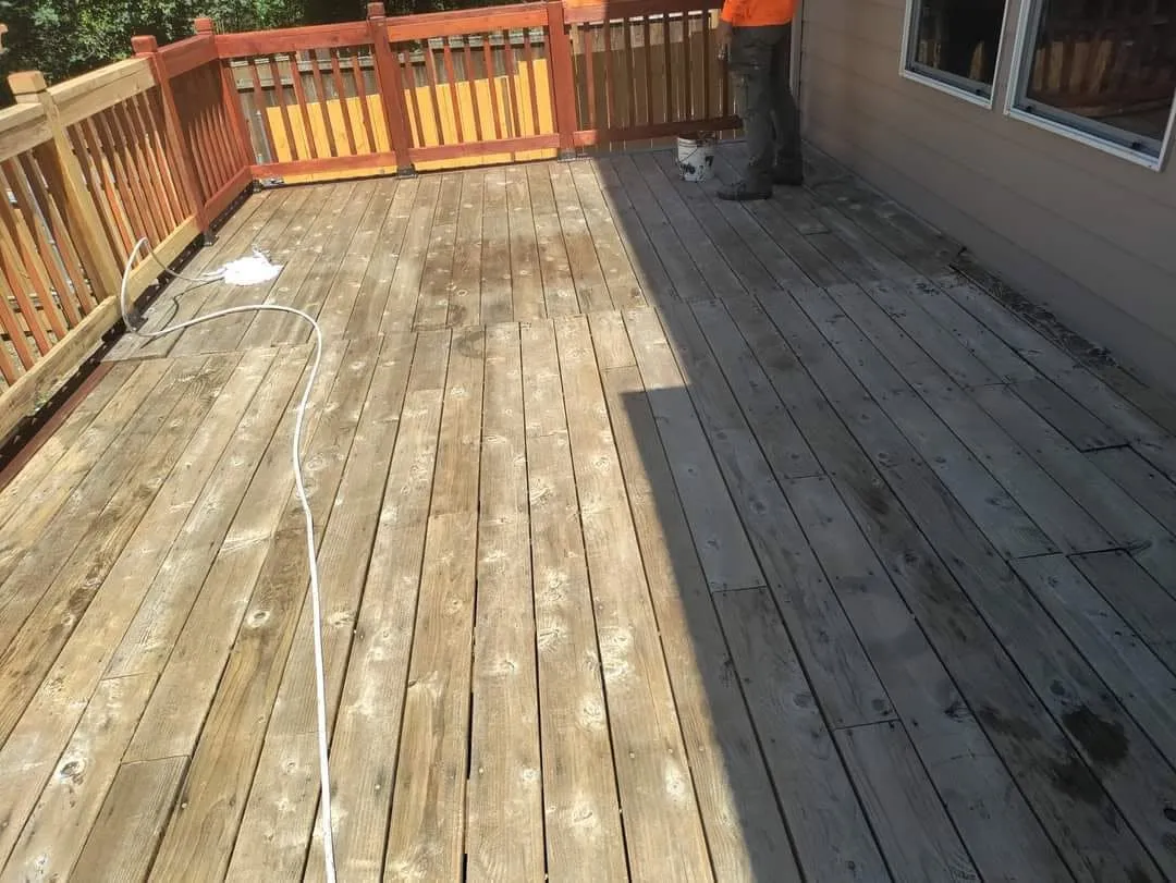 Before: deck boards weathered gray with dirt and mildew