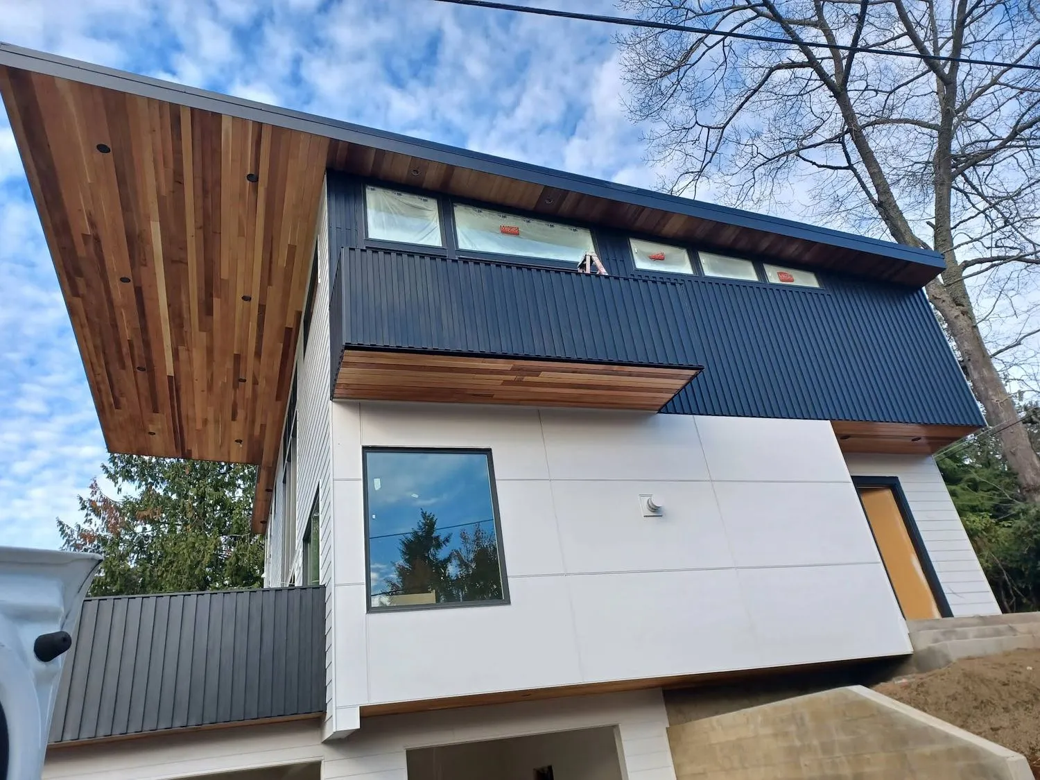 Modern Beaverton, OR home with freshly painted white siding and dark trim